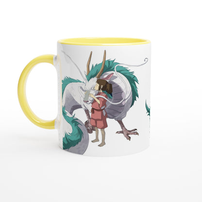 A white mug depicts Chihiro hugging Haku, a dragon from the Studio Ghibli film Spirited Away.