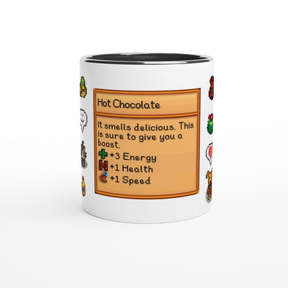 A white mug with a black handle features a Stardew Drinks pattern depicting a hot chocolate card with icons and stats related to energy, health, and speed.