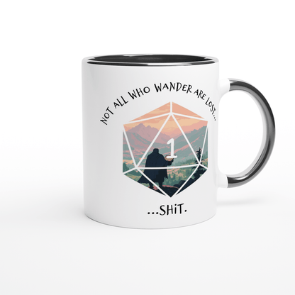 A white mug with a black rim features a D&D-style d20 die displaying a "1" superimposed over a mountain landscape and the words "Not all who wander are lost...shit.