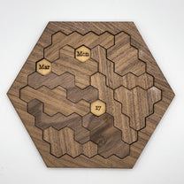 This wooden hexomino puzzle, inspired by Star Trek, displays the dates "Mar," "Mon," and "17" on rotating sections.