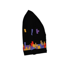 A black knit cardigan featuring a colorful Tetromino game pattern of falling blocks along the bottom hem.