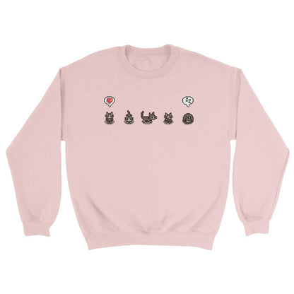 A grey Stardew Valley jumper displays pixelated cats and emotes across the chest.