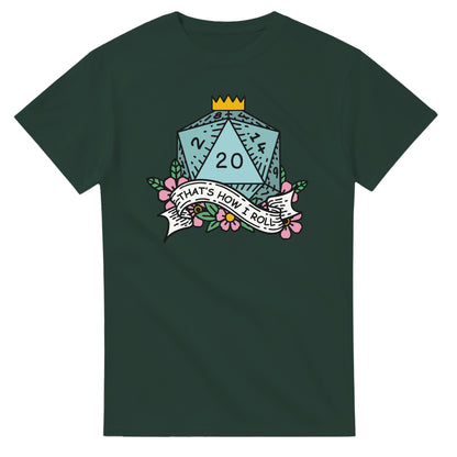 A dark green t-shirt displays a D20 die graphic with floral accents and the words "That's How I Roll" printed on a ribbon, referencing Dungeons & Dragons gameplay.