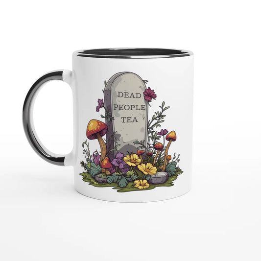 A white ceramic mug with a black handle and rim features an illustration of a tombstone surrounded by flowers and mushrooms that reads "Dead People Tea.