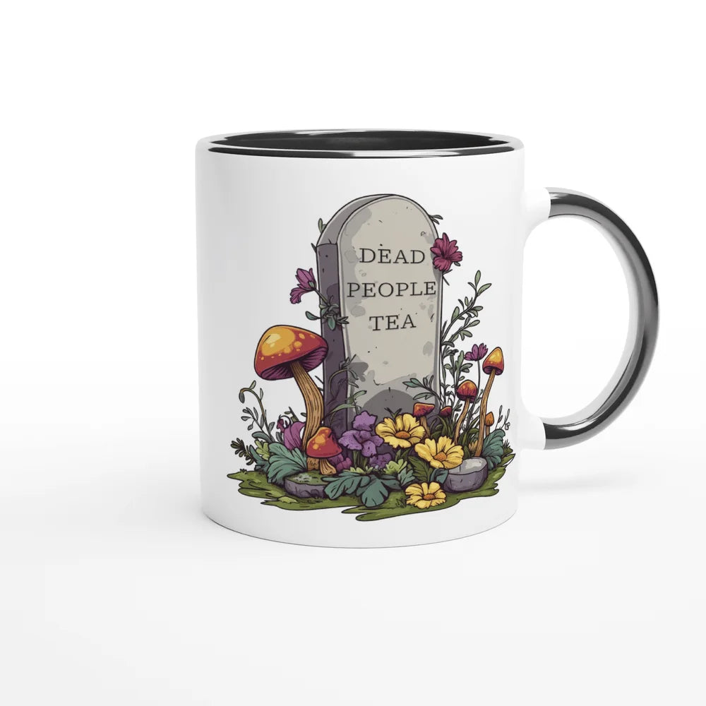 A white ceramic mug features an illustration of a tombstone surrounded by flowers and mushrooms, displaying "Dead People Tea" in text.