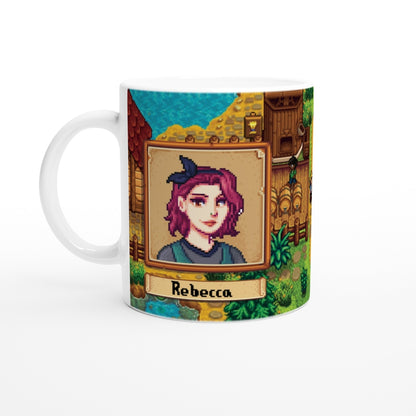 A white mug displays a Stardew custom avatar of Rebecca with pixelated art and a background depicting a building and foliage, accompanied by her name in a decorative banner.