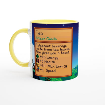 A Stardew Custom Farm Mug displays a pixelated description of tea, including its artisan goods status and benefits like energy and health boosts.