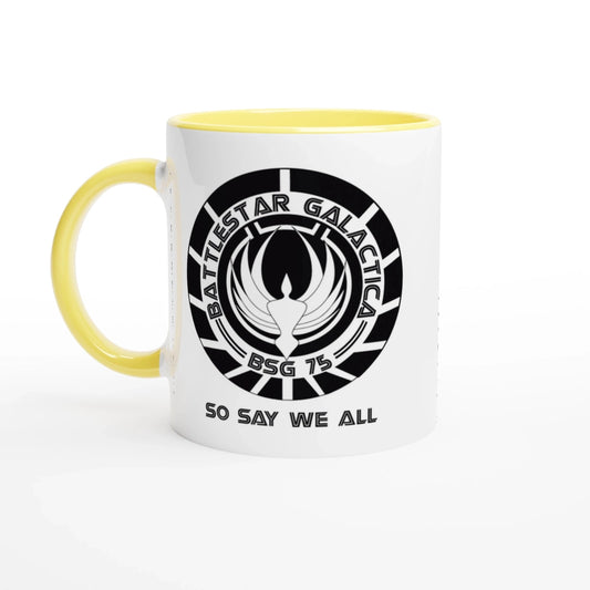 A white ceramic mug featuring the Battlestar Galactica BSG 75 logo and the phrase So Say We All in black text with a yellow interior and handle.