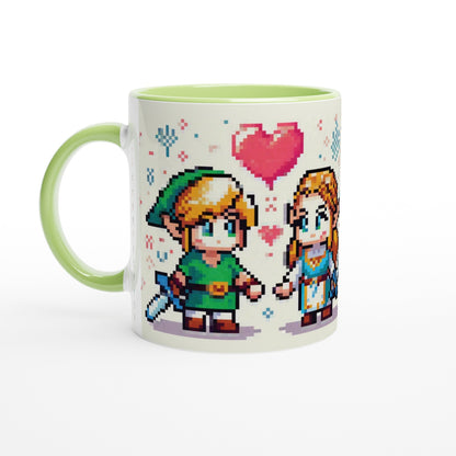 A white mug features chibi pixel art of Link and Zelda from The Legend of Zelda standing together with a heart above them.