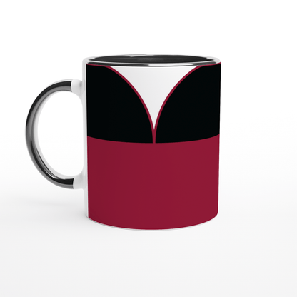A white ceramic mug displays a design inspired by a Star Trek TNG uniform featuring red, black, and white panels.