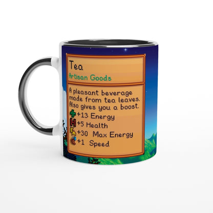 A white-handled mug displays a Stardew Valley-inspired design featuring an information panel about tea and its benefits.
