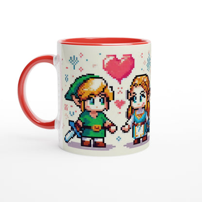 A red mug displays a pixel art illustration of Link and Zelda from The Legend of Zelda standing close together with a heart above them.