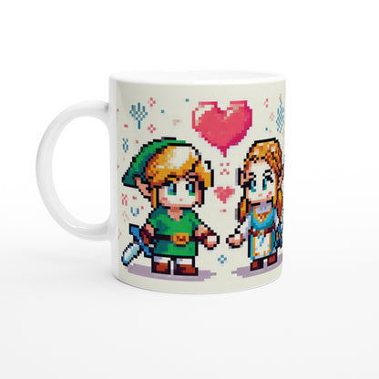 A white mug displays a chibi pixel art illustration of Link and Zelda from The Legend of Zelda looking at each other with a heart above them.