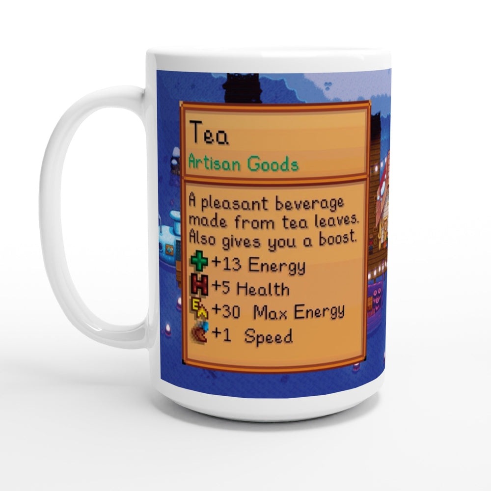 A white ceramic mug featuring a Stardew Valley pixel art interface displaying tea as an artisan good that provides boosts to energy, health, max energy, and speed.