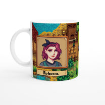 A white mug displays a Stardew custom avatar of Rebecca with pixelated art and a background depicting a building and grassy landscape.