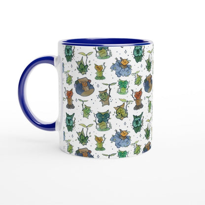 A white ceramic mug features a repeating pattern of Korok characters from The Legend of Zelda: Breath of the Wild and Tears of the Kingdom.