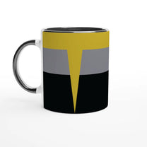 A white mug displays a design inspired by Star Trek Voyager uniforms featuring horizontal bands of black, gray, and yellow with a pointed accent.