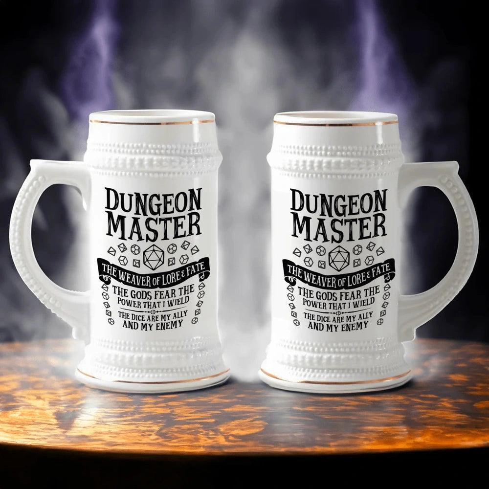 A white ceramic Dungeon Master tankard features gold accents and D&D-themed magic and imagery.