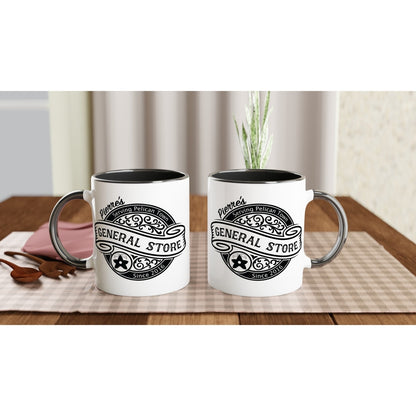 Two ceramic mugs display a black handle and rim, featuring a white design of Pierre's General Store logo from Stardew Valley, including the words "Pelican Town" and "Since 2016.