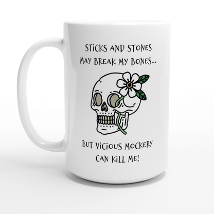 A white mug displays the text "Sticks and Stones May Break My Bones... But Vicious Mockery Can Kill Me!" alongside a drawing of a skull adorned with a flower.