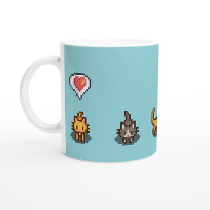 A white mug displays pixel art of ginger and tabby cats alongside heart emotes from the Stardew Valley computer game.