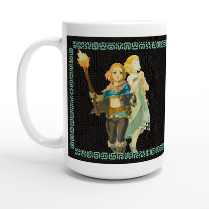 A white mug displays an illustration of Link and Zelda from The Legend of Zelda: Tears of the Kingdom alongside a repeating Sheikah symbol pattern.
