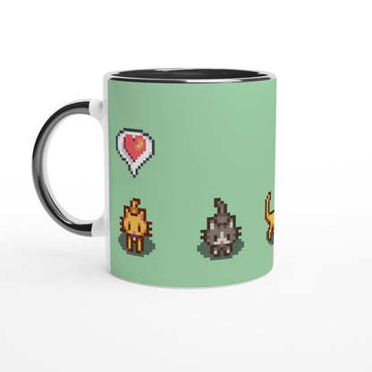 A white mug displays pixel art graphics from Stardew Valley featuring ginger and tabby cats alongside emotes and a heart icon.