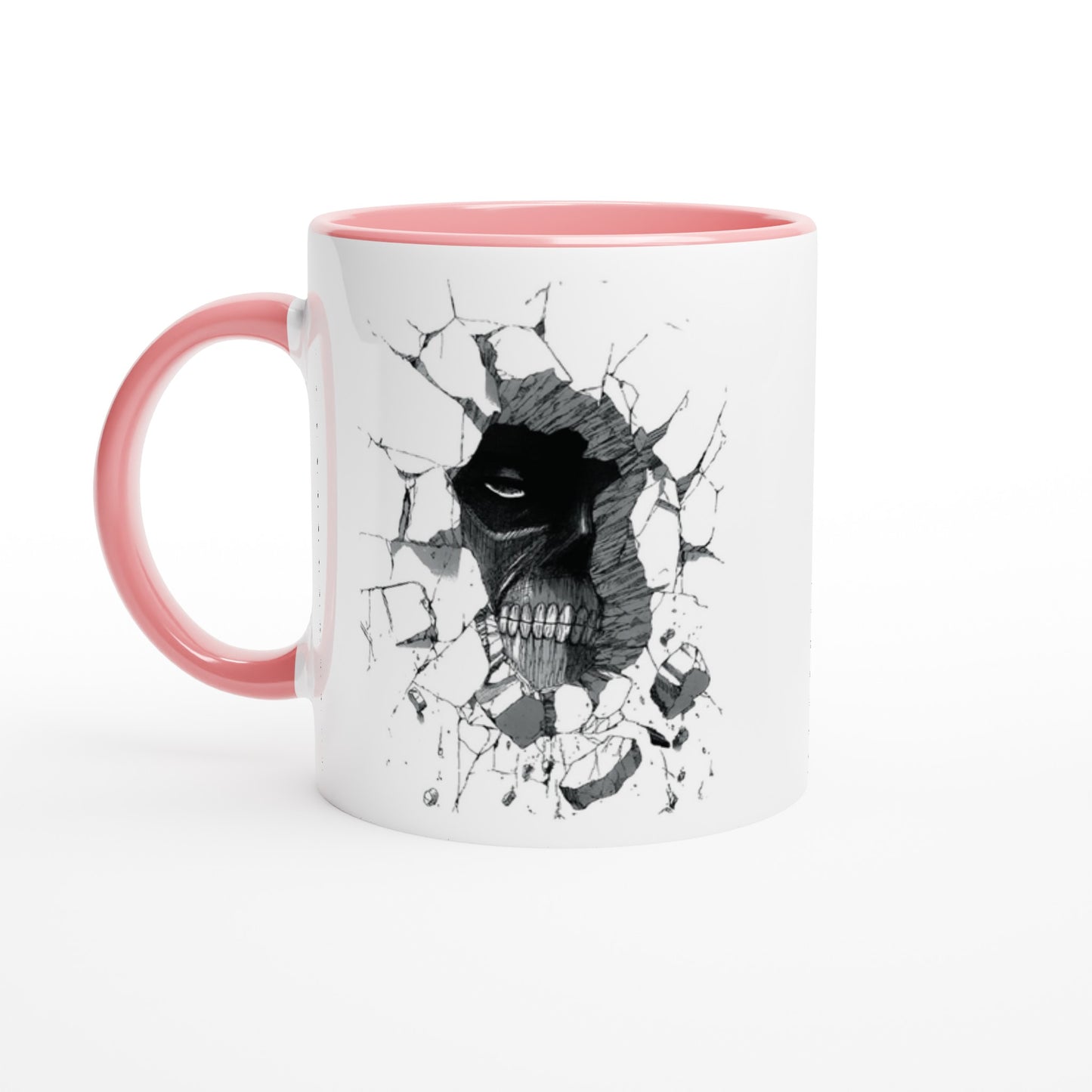 A white ceramic mug with a pink handle features an illustration of the Colossal Titan from Attack on Titan breaking through a wall.