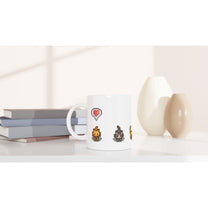 A white mug displays pixelated images of a heart, ginger cat, and tabby cat, referencing Stardew Valley emotes.