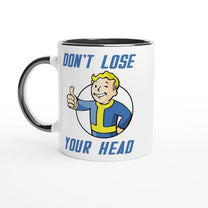 A white mug with a black rim features Vault-Tec branding and cartoon character giving a thumbs up alongside the words "Don't Lose Your Head," referencing the Fallout video game series.