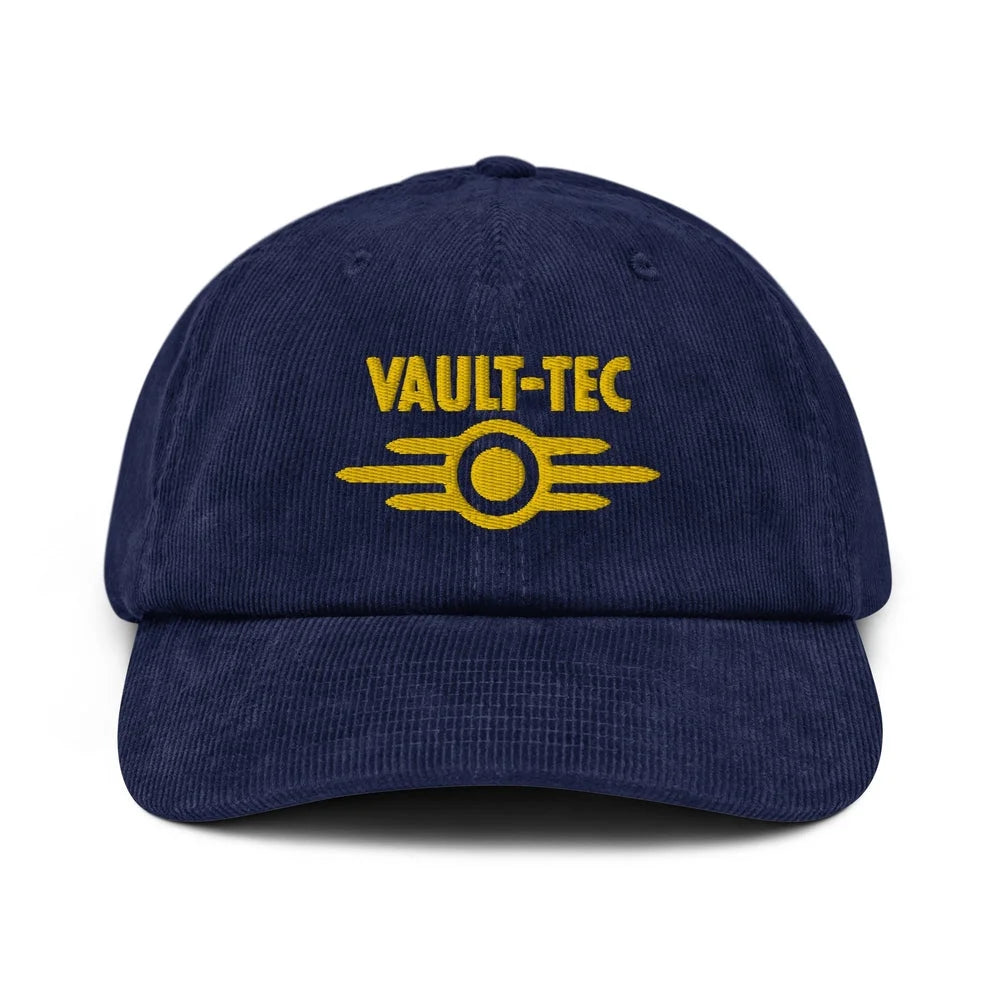 A blue Vault-Tec baseball cap features yellow embroidered lettering and a logo referencing the Fallout video game series.