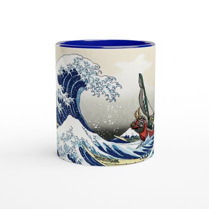 A white mug features a design combining Hokusai's Great Wave off Kanagawa with Link from The Legend of Zelda: Wind Waker sailing in a boat.