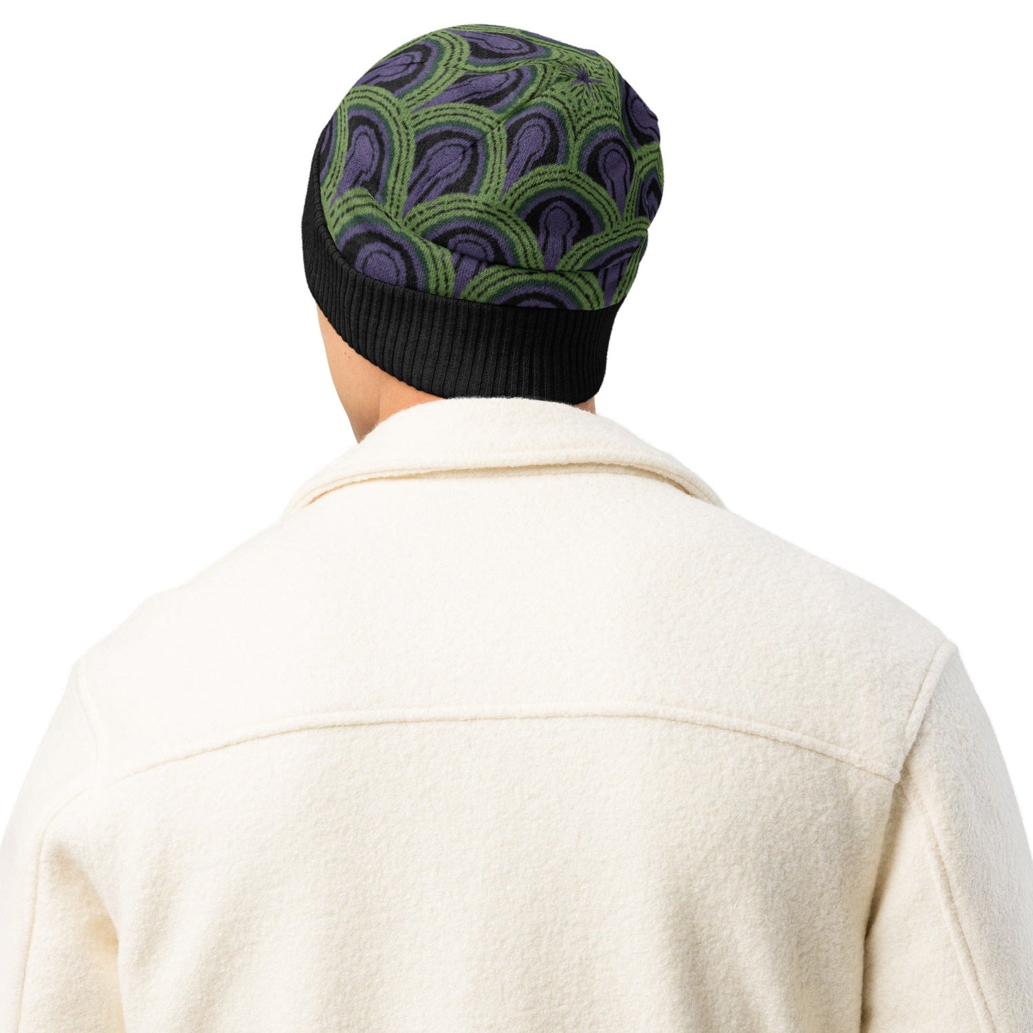 Man wearing a  green, purple and black Room 237 Overlook Hotel patterned knitted beanie from The Shining
