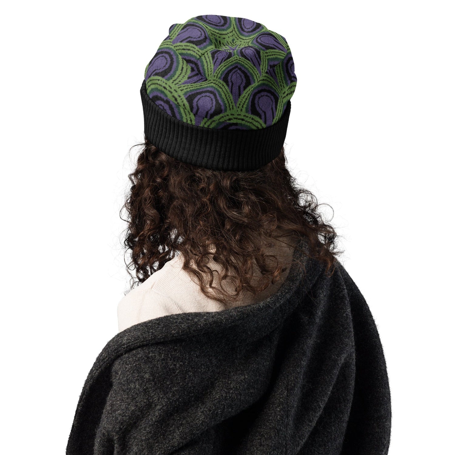 Woman wearing a  green, purple and black Room 237 Overlook Hotel patterned knitted beanie from The Shining