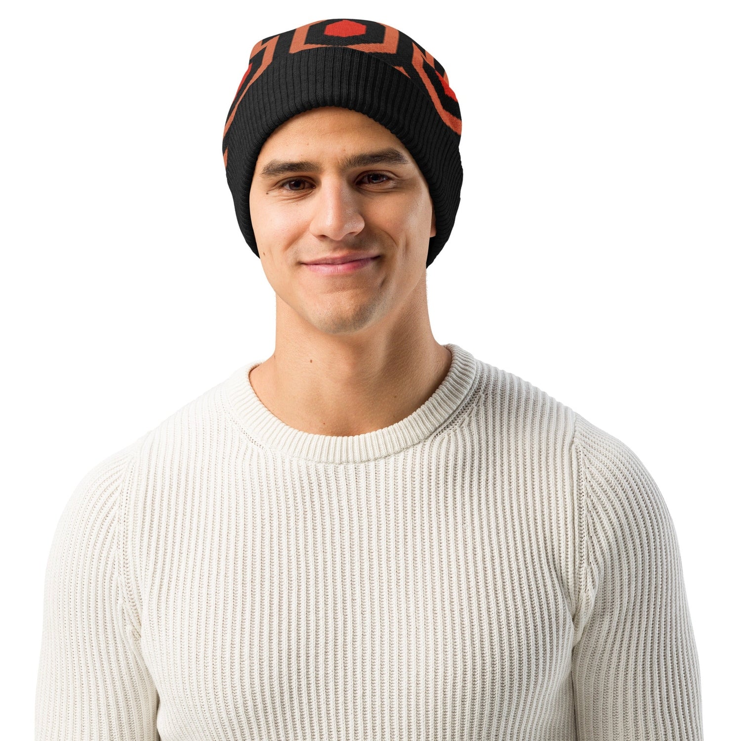 Man wearing an Overlook Hotel carpet pattern knitted beanie in orange, black and red on a white background