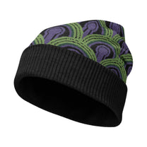 A knitted winter beanie hat featuring a purple and green Room 237 wallpaper pattern inspired by The Shining.