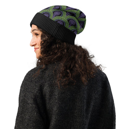 Woman wearing a  green, purple and black Room 237 Overlook Hotel patterned knitted beanie from The Shining