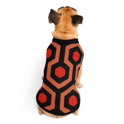 Dog wearing a Overlook Hotel carpet geometric patterned coat on a white background