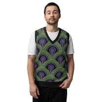 A man wearing a v-neck knit sweater vest featuring a green and purple Room 237 wallpaper pattern inspired by horror films.