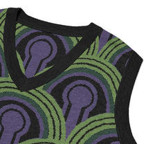 A close-up of a V-neck knitted sweater vest featuring a green, purple, and black Room 237 wallpaper pattern inspired by horror films.