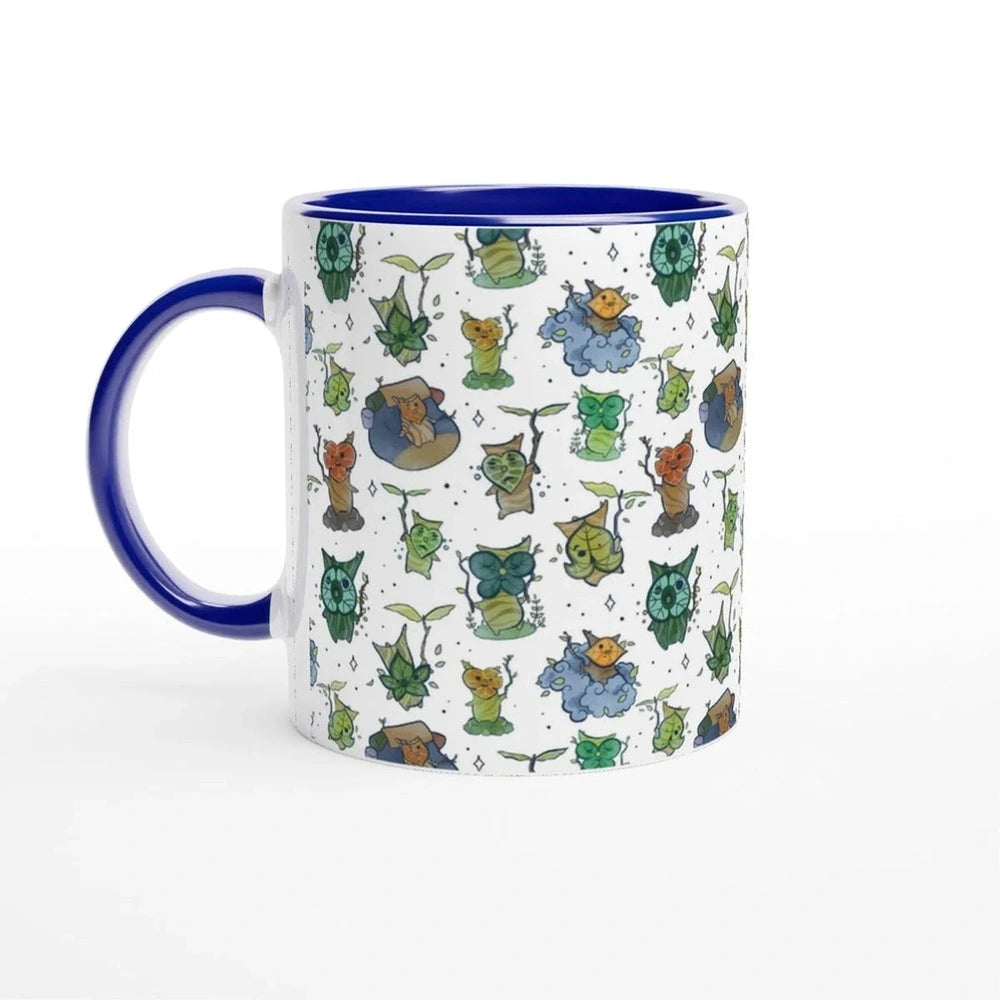 A white ceramic mug features a repeating pattern of Korok characters from The Legend of Zelda: Breath of the Wild and Tears of the Kingdom.
