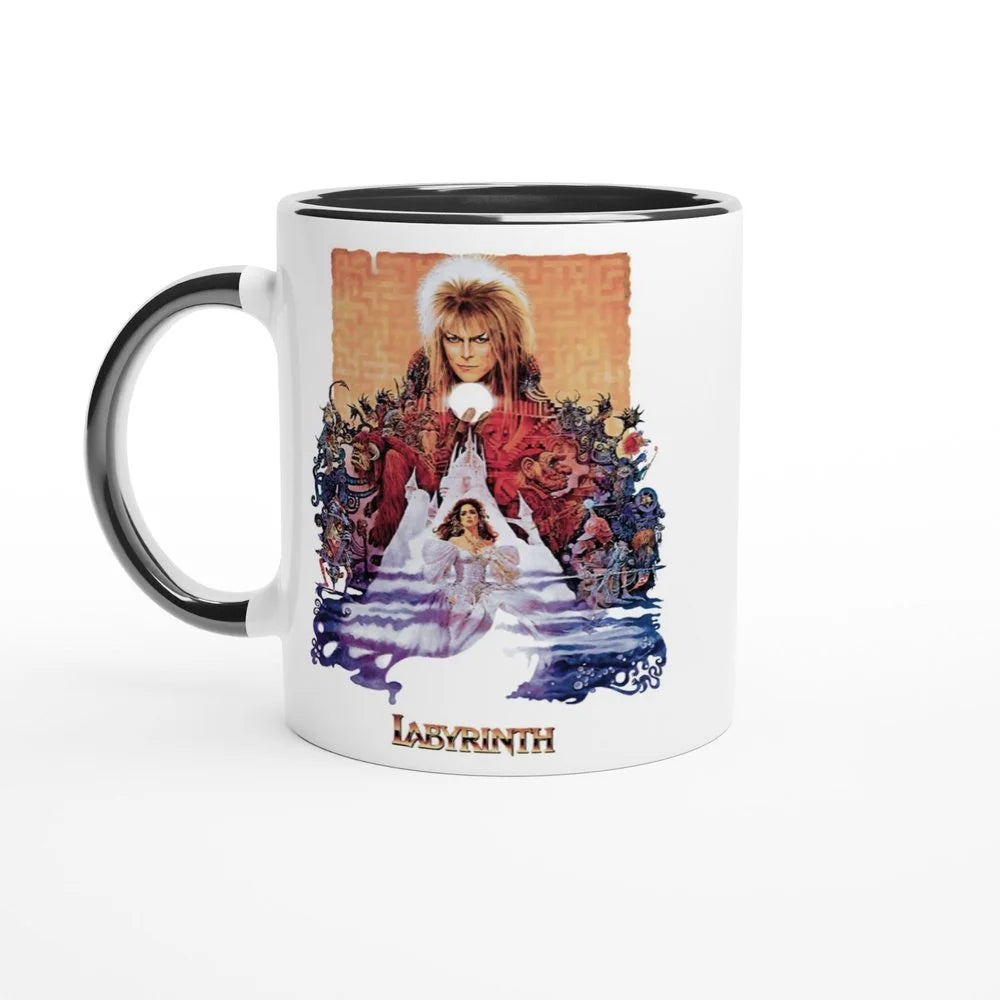 A white mug features a graphic from the 1986 fantasy movie Labyrinth depicting David Bowie as Jareth and Jennifer Connelly's character Sarah in front of a maze.
