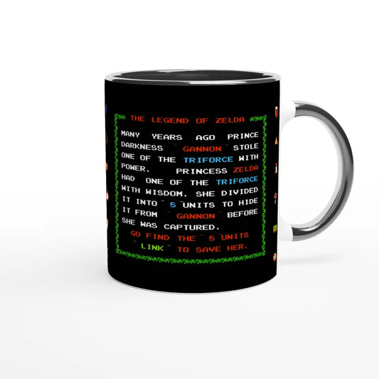 A white ceramic mug displays a recreation of the 1986 NES title screen for The Legend of Zelda, featuring green pixelated text describing the game's plot.