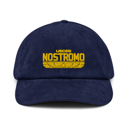 A dark blue baseball cap features an embroidered yellow "USCS Nostromo" logo with a wings style design, referencing the Alien film franchise.
