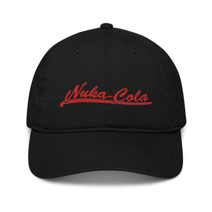 A black dad hat features red embroidered "Nuka-Cola" branding referencing the Fallout video game series.