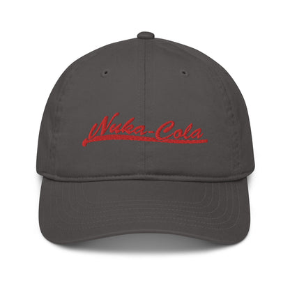 A gray dad hat features red embroidered "Nuka-Cola" lettering across the front panel.
