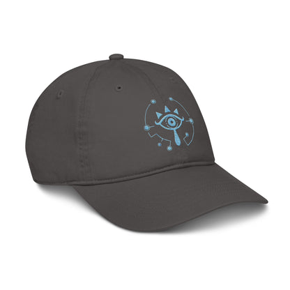 A gray Zelda Sheikah embroidered cap features a blue glowing design inspired by Tears of the Kingdom.