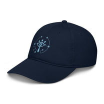 A navy blue dad hat features an embroidered Sheikah eye symbol from The Legend of Zelda: Tears of the Kingdom.