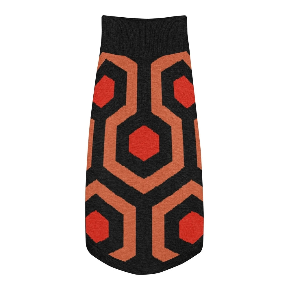 A knit pet sweater featuring a black, orange, and red geometric pattern inspired by the Overlook Hotel carpet.