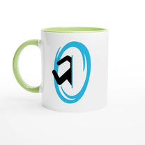 A white ceramic mug with a green handle and rim features a blue Portal symbol from the Half-Life video game.